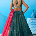 Luxurious Dark Green Cosmos Silk Embroidered Lehenga Choli with Pink Dupatta