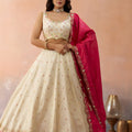 Beautiful Cream Cosmos Silk Embroidered Lehenga Choli with Pink Dupatta
