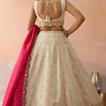 Beautiful Cream Cosmos Silk Embroidered Lehenga Choli with Pink Dupatta