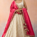 Beautiful Cream Cosmos Silk Embroidered Lehenga Choli with Pink Dupatta