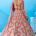Lovable Dusty Pink Tissue Embroidered Lehenga Choli with Dupatta
