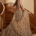 Stylish Beige Embroidered Wedding Wear Lehenga Choli with Net Dupatta