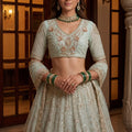 Glorious Sea Green Embroidered Wedding Wear Lehenga Choli with Net Dupatta