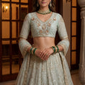 Glorious Sea Green Embroidered Wedding Wear Lehenga Choli with Net Dupatta