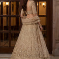 Elegant Beige Embroidered Wedding Wear Lehenga Choli with Net Dupatta