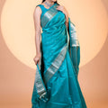 Teal Blue Paithani Silk Saree with Silver Zari Border Floral Pallu