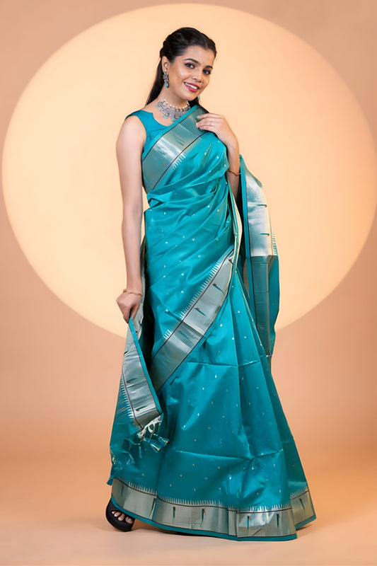 Teal Blue Paithani Silk Saree with Silver Zari Border Floral Pallu