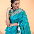 Teal Blue Paithani Silk Saree with Silver Zari Border Floral Pallu