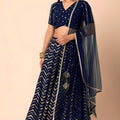 Luxury Royal Blue Faux Georgette Sequins Embroidered Lehenga Choli with Net Dupatta