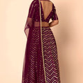 Stylish Wine Faux Georgette Sequins Embroidered Lehenga Choli with Net Dupatta