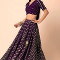 Stunning Purple Faux Georgette Sequins Embroidered Lehenga Choli with Net Dupatta
