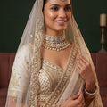 Elegant Off White Gadhwal Silk Embroidered Bridal Lehenga Choli with Heavy Net Dupatta