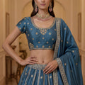Exquisite Sky Blue Silk Embroidered Lehenga Choli with Peacock Motif Border and Designer Dupatta