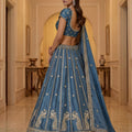 Exquisite Sky Blue Silk Embroidered Lehenga Choli with Peacock Motif Border and Designer Dupatta