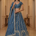 Exquisite Sky Blue Silk Embroidered Lehenga Choli with Peacock Motif Border and Designer Dupatta