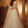 Stylish Off White Net Heavy Embroidered Lehenga Choli with Designer Dupatta for Wedding
