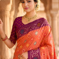 Wonderful Peach Patola Silk Saree Floral Woven Border Wedding Wear