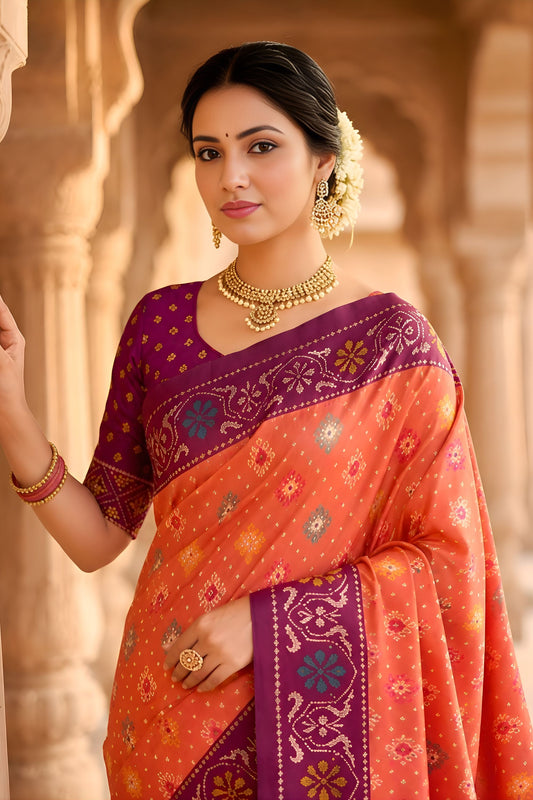 Wonderful Peach Patola Silk Saree Floral Woven Border Wedding Wear