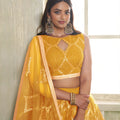 Stylish Mustard Yellow Butterfly Net Designer Lehenga Choli with Heavy Embroidery Work for Wedding