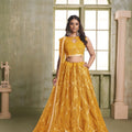 Stylish Mustard Yellow Butterfly Net Designer Lehenga Choli with Heavy Embroidery Work for Wedding