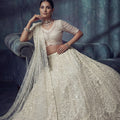 Elegant Off White Net Lehenga Choli with Heavy Embroidery Work for Wedding