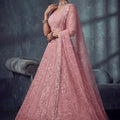 Impressive Dusty Rose Pink Net Lehenga Choli with Heavy Embroidery Work for Wedding