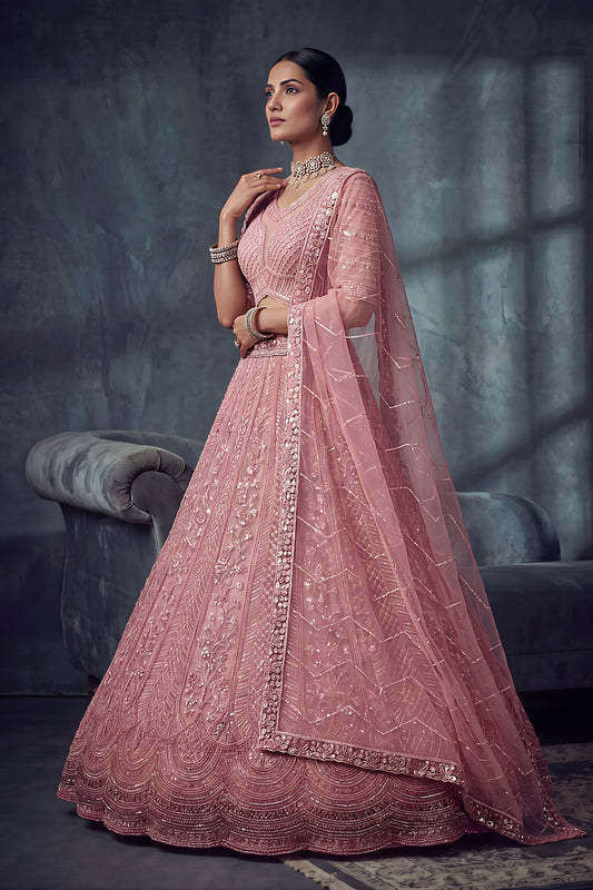 Impressive Dusty Rose Pink Net Lehenga Choli with Heavy Embroidery Work for Wedding