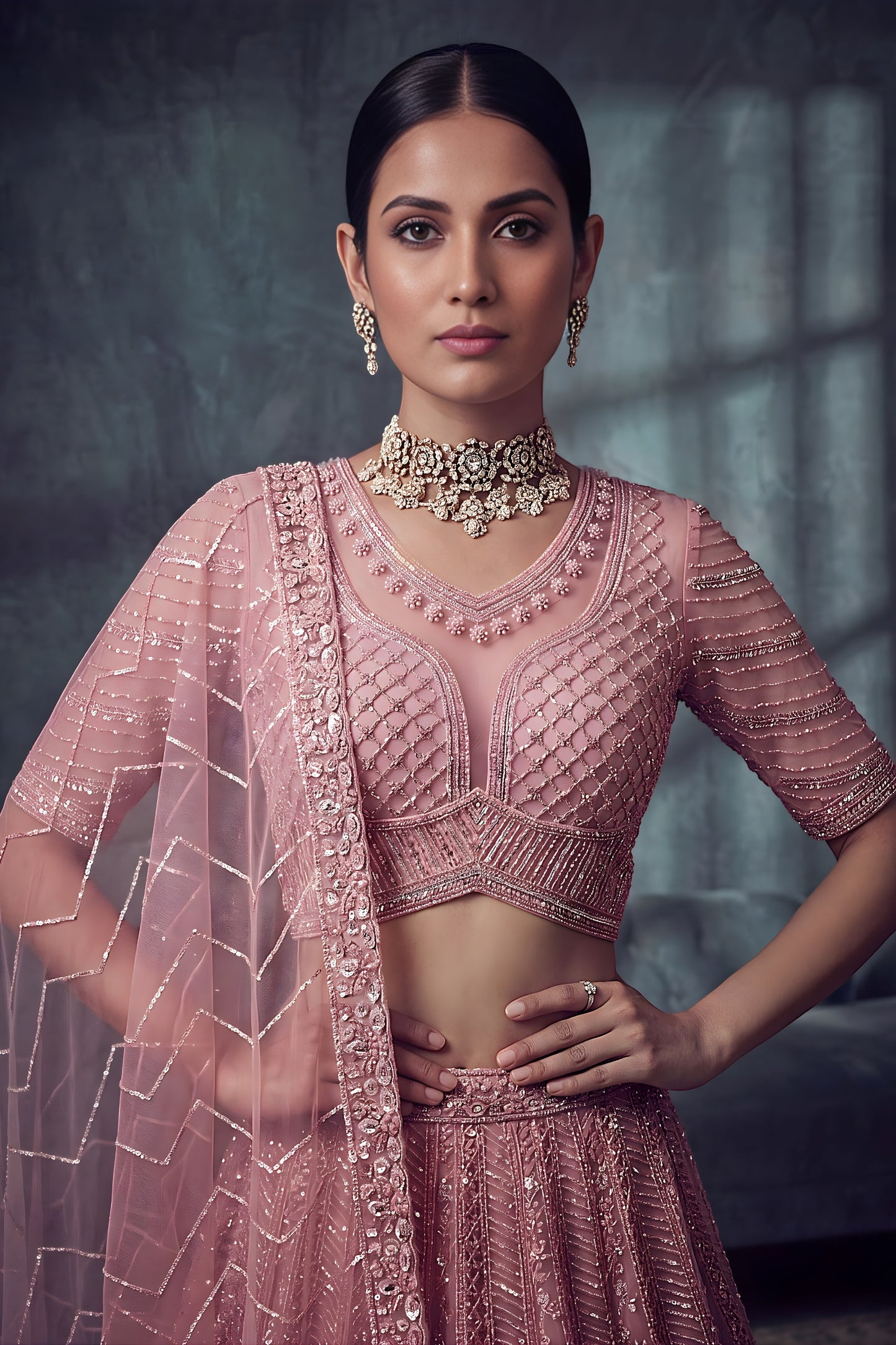 Impressive Dusty Rose Pink Net Lehenga Choli with Heavy Embroidery Work for Wedding