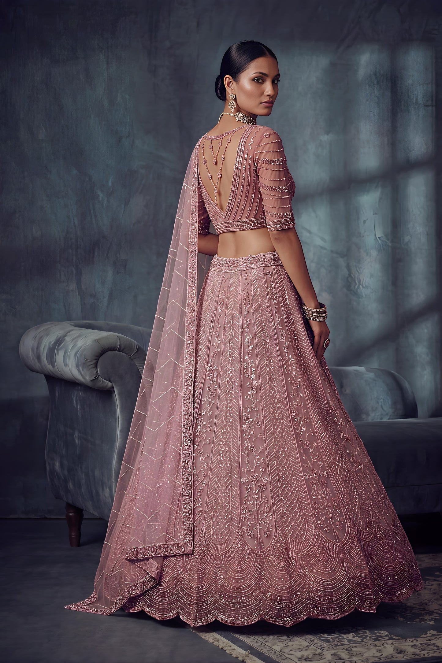 Impressive Dusty Rose Pink Net Lehenga Choli with Heavy Embroidery Work for Wedding