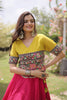 Stunning Rani Pink and Yellow Roman Silk Navratri Lehenga Choli with Kutchi Gamthi Embroidery Work