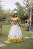 Impressive White and Yellow Roman Silk Navratri Lehenga Choli with Kutchi Gamthi Embroidery Work
