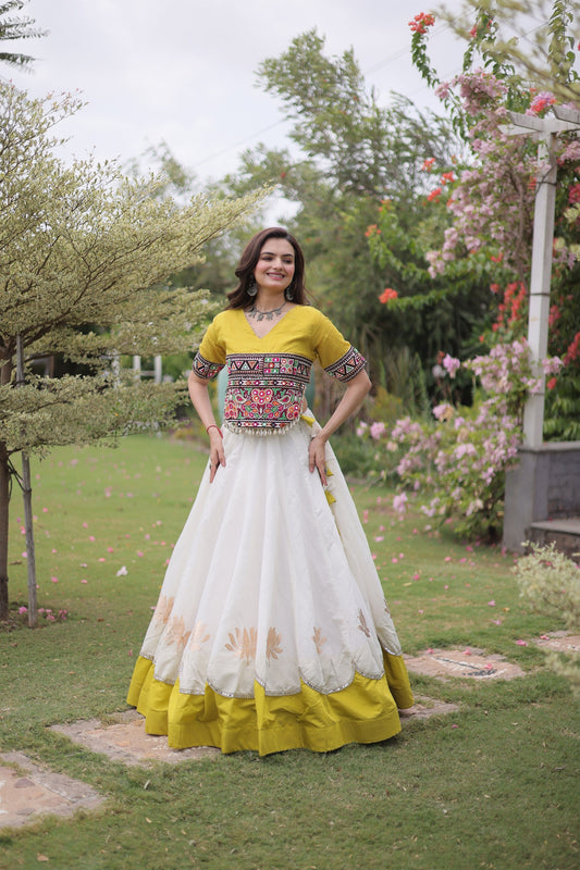 Impressive White and Yellow Roman Silk Navratri Lehenga Choli with Kutchi Gamthi Embroidery Work