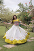 Impressive White and Yellow Roman Silk Navratri Lehenga Choli with Kutchi Gamthi Embroidery Work