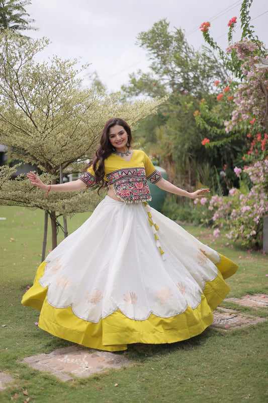 Impressive White and Yellow Roman Silk Navratri Lehenga Choli with Kutchi Gamthi Embroidery Work