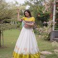 Impressive White and Yellow Roman Silk Navratri Lehenga Choli with Kutchi Gamthi Embroidery Work