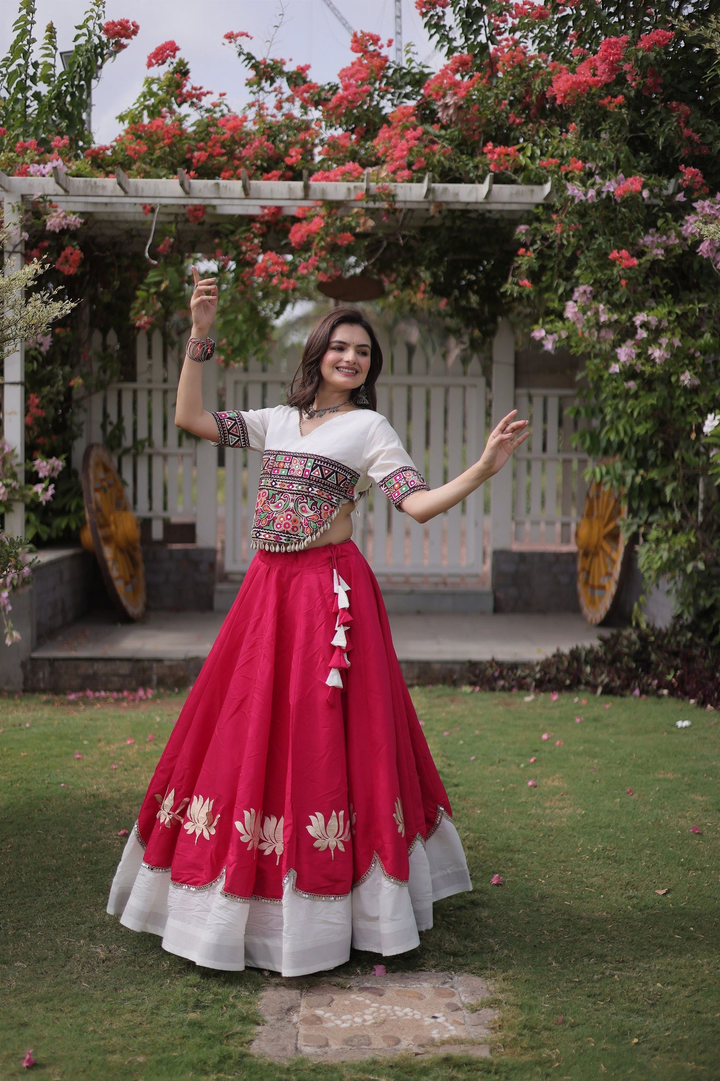 Awesome White and Rani Pink Roman Silk Navratri Lehenga Choli with Kutchi Gamthi Embroidery Work