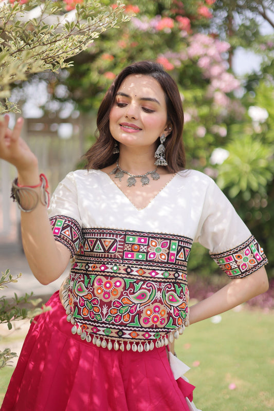 Awesome White and Rani Pink Roman Silk Navratri Lehenga Choli with Kutchi Gamthi Embroidery Work