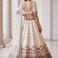 Charming Off White Designer Bridal Lehenga Choli with Heavy Embroidery Work and Net Dupatta
