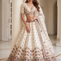 Charming Off White Designer Bridal Lehenga Choli with Heavy Embroidery Work and Net Dupatta
