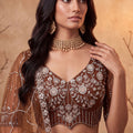 Charming Rust Orange Net Heavy Embroidered Designer Lehenga Choli with Dupatta