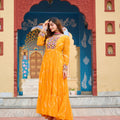 Mustard Yellow Bandhani Print Faux Georgette Gown with Mirror Work for Navratri