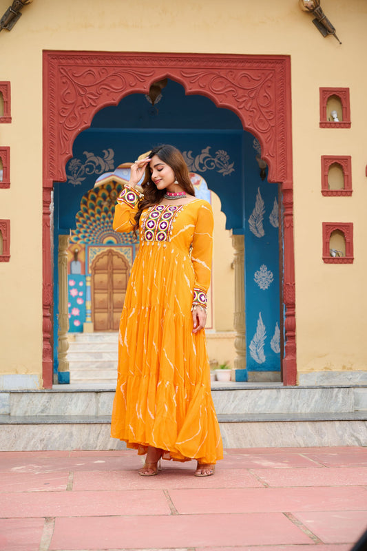 Mustard Yellow Bandhani Print Faux Georgette Gown with Mirror Work for Navratri