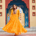 Mustard Yellow Bandhani Print Faux Georgette Gown with Mirror Work for Navratri