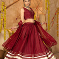 Maroon Silk Navratri Lehenga Choli with Gold Zari Border and Sleeveless Blouse