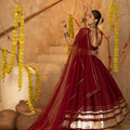 Maroon Silk Navratri Lehenga Choli with Gold Zari Border and Sleeveless Blouse