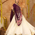 Cream Silk Navratri Lehenga Choli with Gold Zari Border and Purple Dupatta