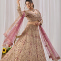 Opulent Mauve Net Designer Lehenga Choli with Heavy Embroidery Work and Dupatta