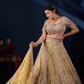 Radiant Beige Tissue Silk Designer Lehenga Choli with Heavy Embroidery Work and Mustard Yellow Dupatta