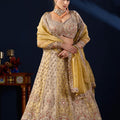 Radiant Beige Tissue Silk Designer Lehenga Choli with Heavy Embroidery Work and Mustard Yellow Dupatta