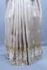 Beige Embroidered Silk Saree Pastel Floral Border Delicate Zari Buti Work